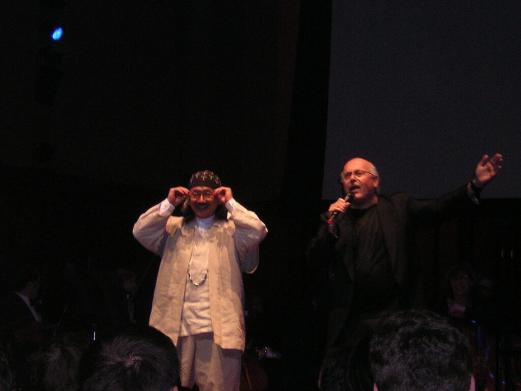 Nobuo Uematsu on stage with conductor Arnie Roth