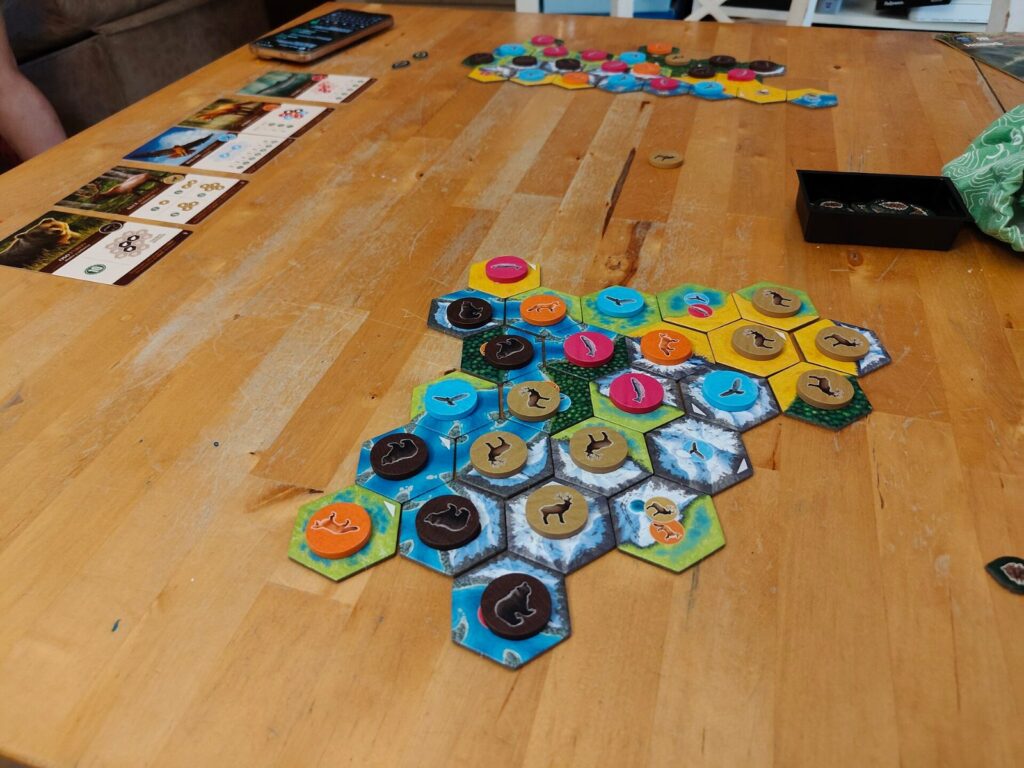 Cascadia habitat tiles and wildlife tokens on a table