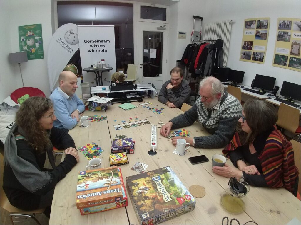 Friends around a table during a board game night