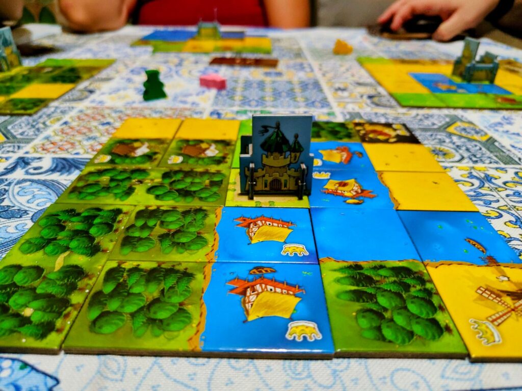 Kingdomino tiles laid out into small kingdoms